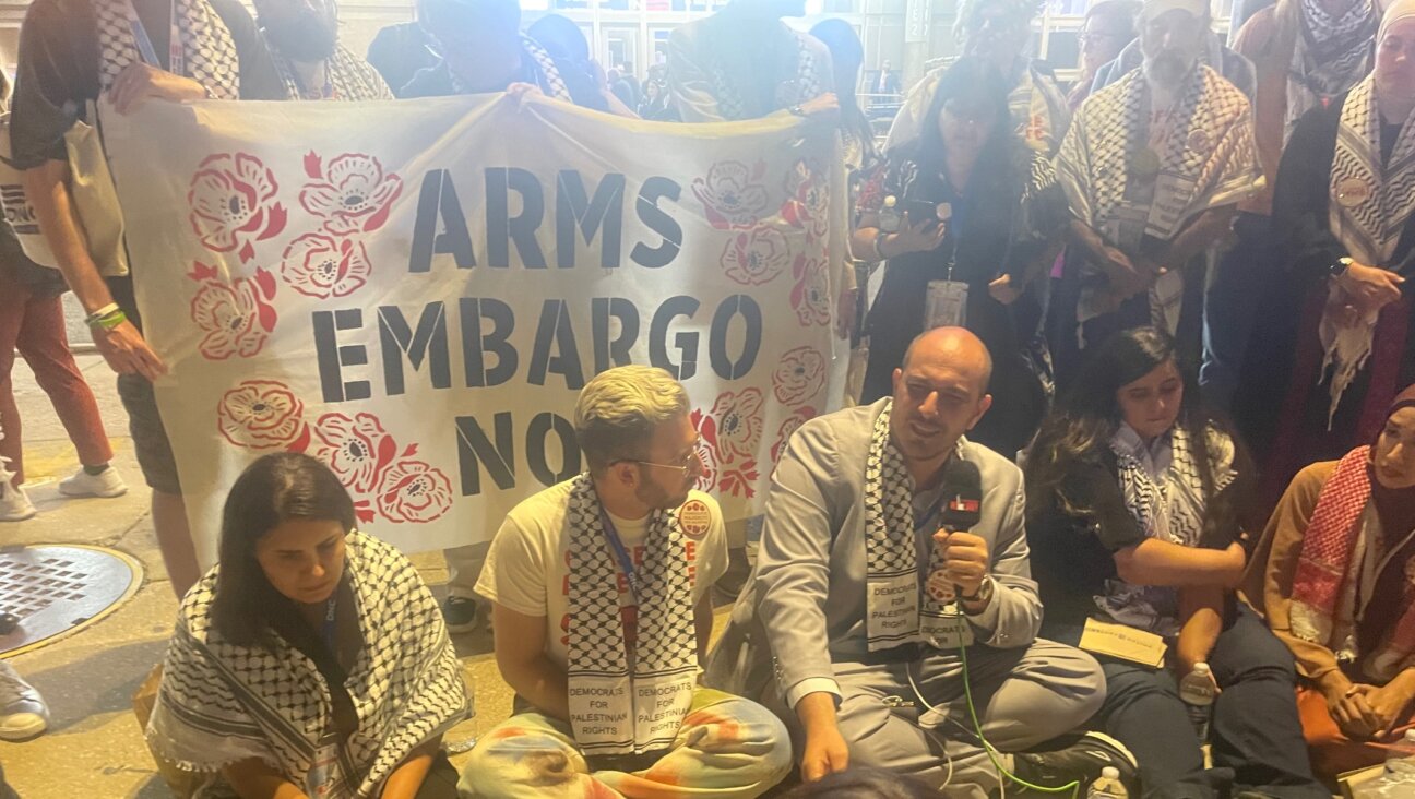 Abbas Alawieh, a leader of pro-Palestinian “Uncommitted” delegates to the Democratic National Convention, conducts a sit-in outside the United Center, Chicago, Aug. 21, 2024