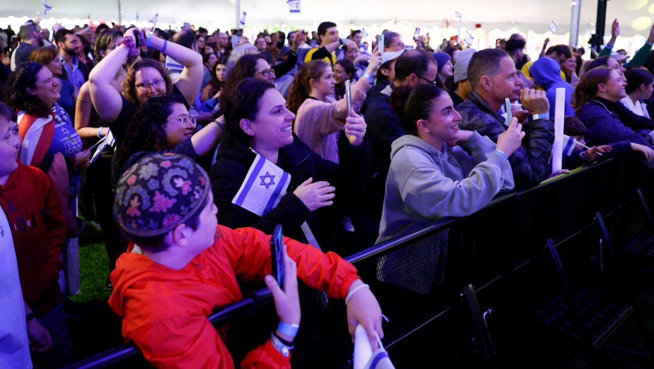 A crowd watches rapper Kosha Dillz perform during the “We Will Dance Again” event presented by MIT Hillel in Cambridge, Massachusetts, May 16, 2024. Hillels have come under fire from some campus encampments, which have demanded schools cut ties with them. (Danielle Parhizkaran/The Boston Globe via Getty Images)