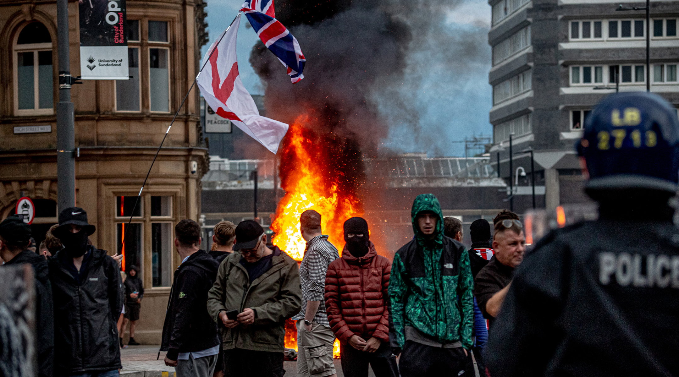 Far-right activists hold an ‘Enough is Enough’ protest in Sunderland, England, August 2, 2024. After the murders of three girls in Southport earlier this week, misinformation spread via social media and fueled acts of violent rioting from far-right, anti-immigration actors across England. (Drik/Getty Images)