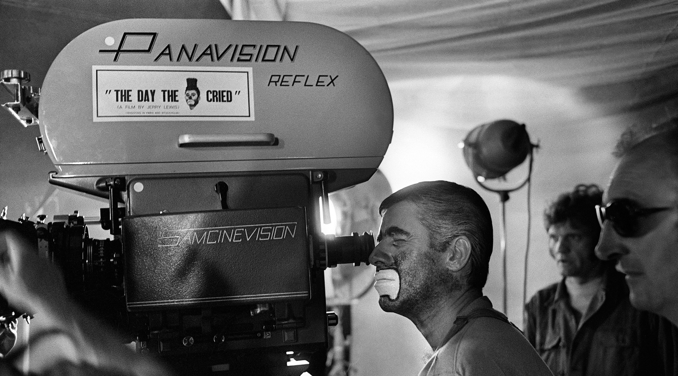 Jerry Lewis (L) looks through the camera on March 22, 1972, during the shooting of the film “The Day the Clown Cried.” (STF/AFP via Getty Images)