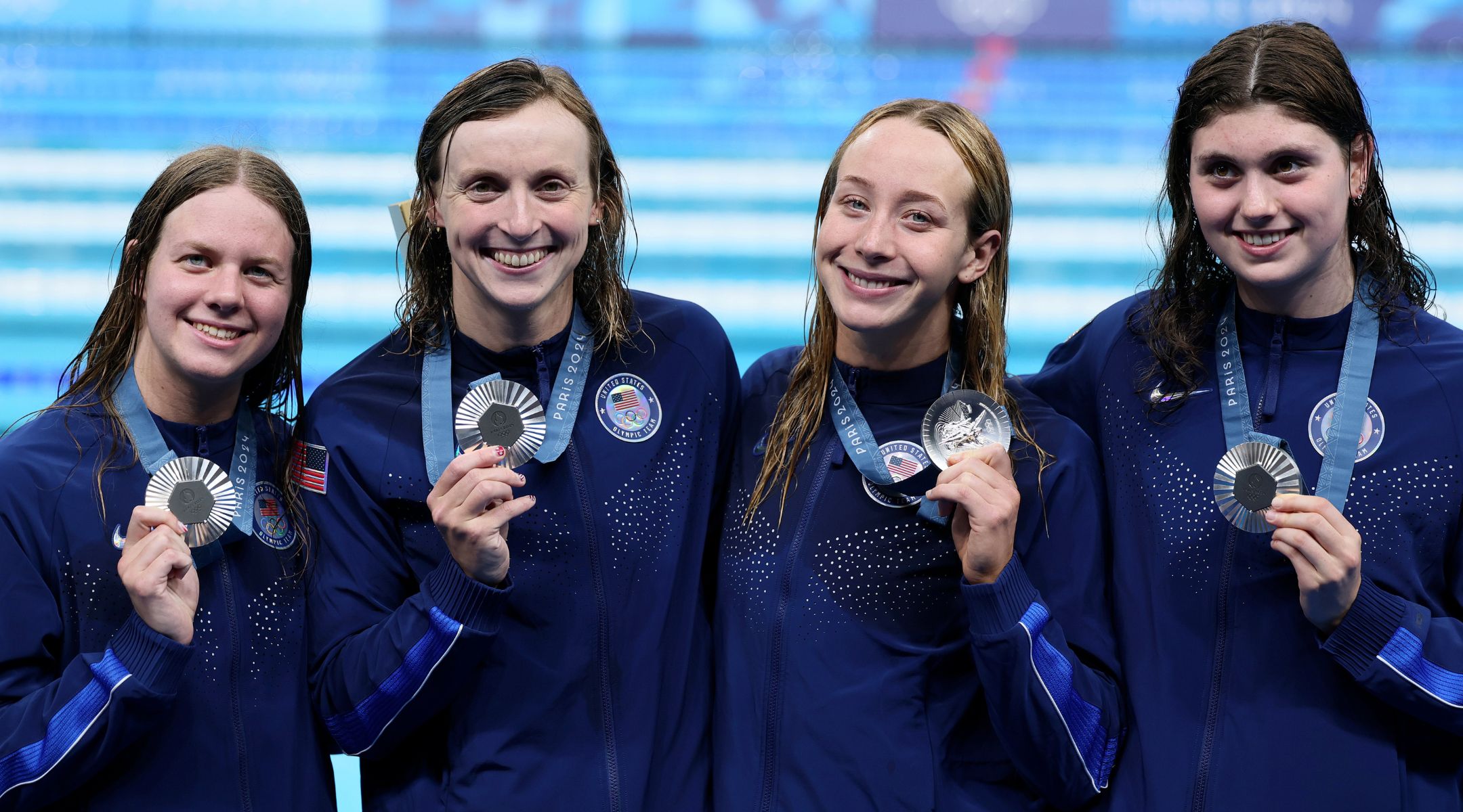 L-R: Erin Gemmel, Katie Ledecky, Paige Madden and Claire Weinstein after winning silver in the women’s 4×200-meter freestyle relay at the 2024 Paris Olympics, Aug. 1, 2024, in Nanterre, France. (Clive Rose/Getty Images)