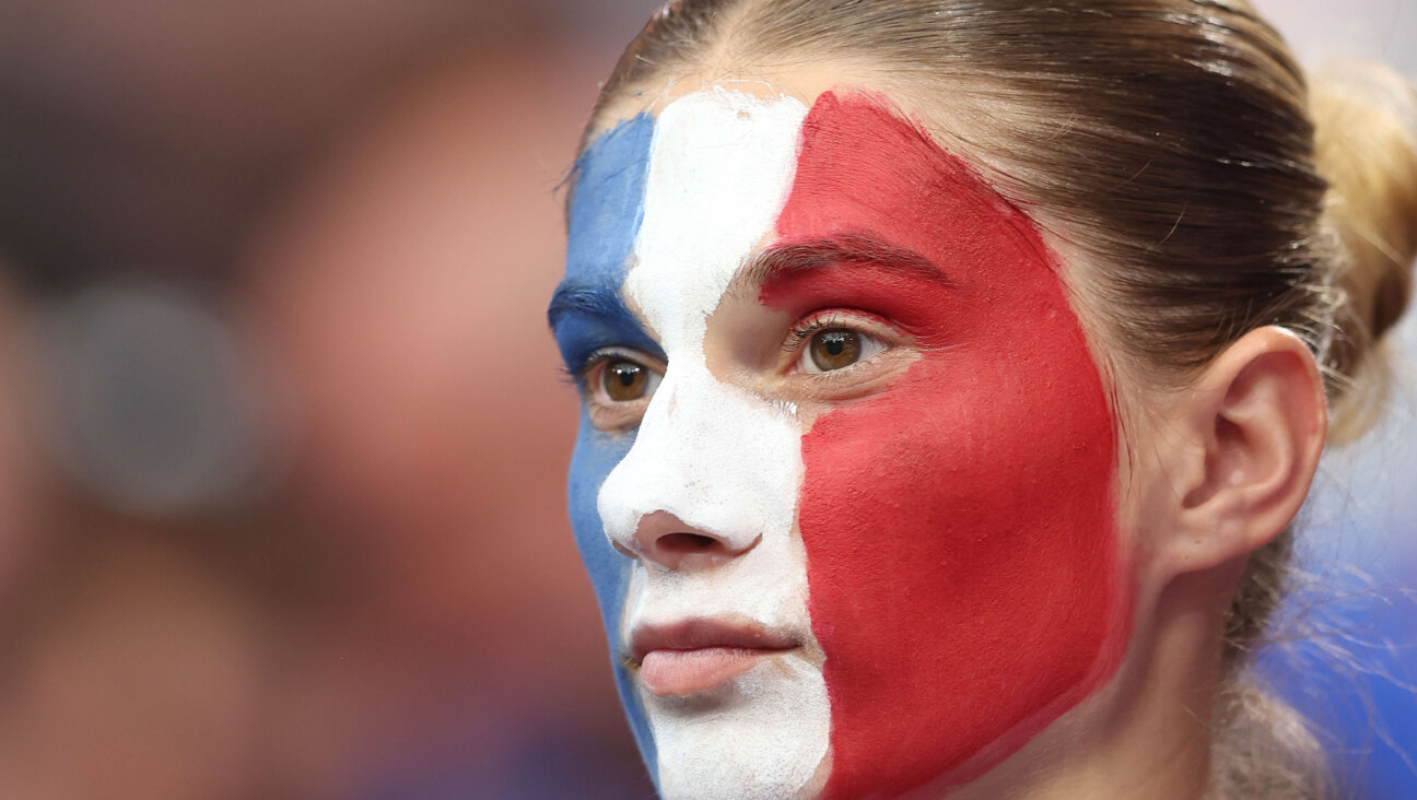 A French sports fan displays her national pride.