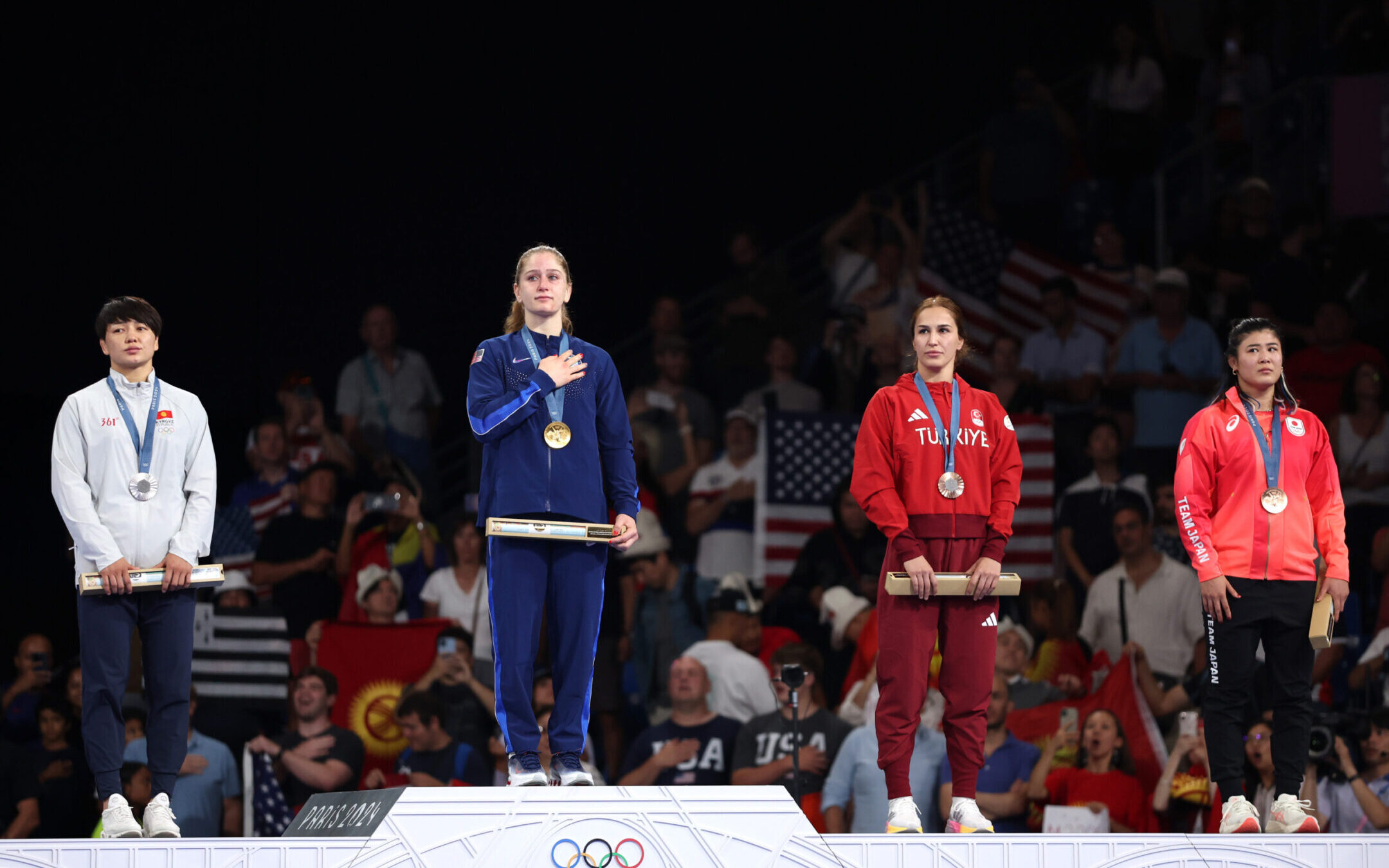 Gold medalist Amit Elor stands on the podium during the wrestling women’s freestyle 68kg medal ceremony of the Paris Olympic Games, Aug. 6, 2024. (Sarah Stier/Getty Images)