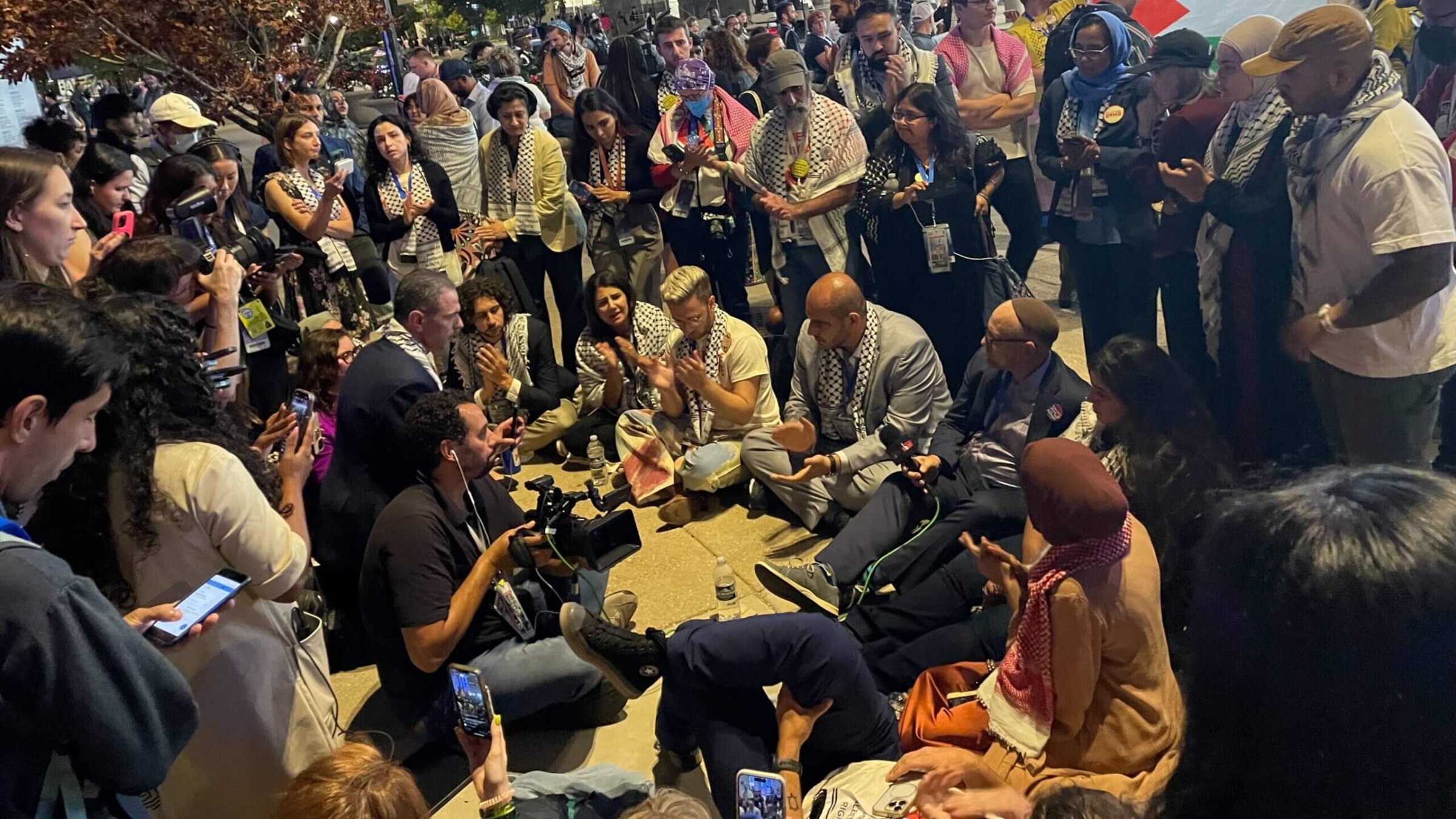 Wednesday evening, "Uncommitted" DNC delegates staged a sit-in to demand that a Palestinian-American be allowed to speak from the main stage.