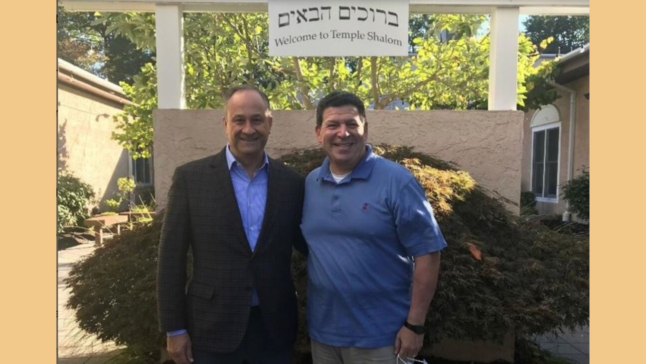 Doug Emhoff (left), who is married to Vice President Kamala Harris, at his childhood synagogue, Temple Shalom of Aberdeen, New Jersey, with Rabbi Laurence Malinger in 2021.