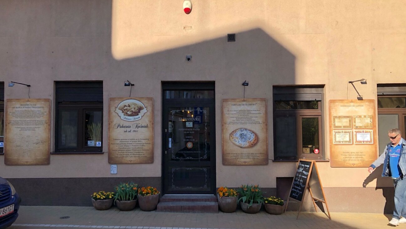 Kuźmiuk Bakery in Lublin, Poland, operates in the shadow of the Holocaust: The family that operates it took over a bakery whose Jewish owners were murdered by the Nazis. (Shira Li Bartov)