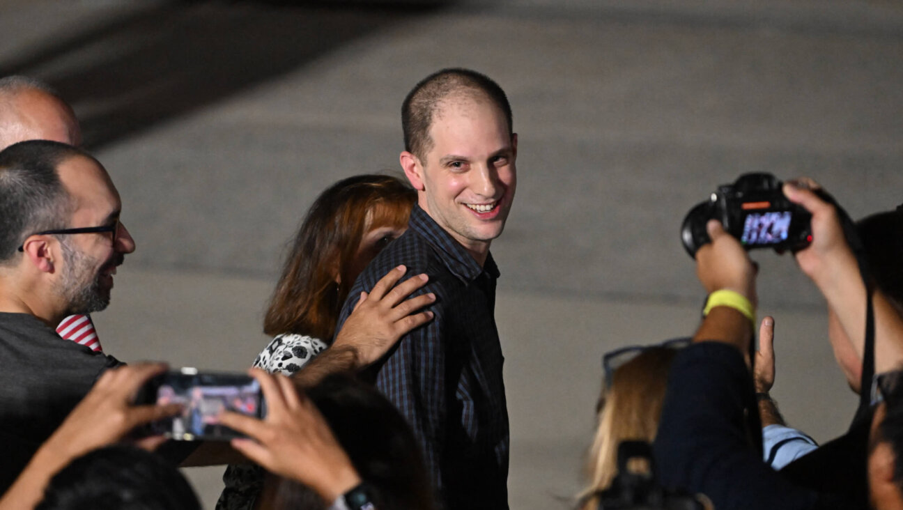 Evan Gershkovich smiles at Joint Base Andrews after returning to the U.S. following a prisoner swap on August 1. 