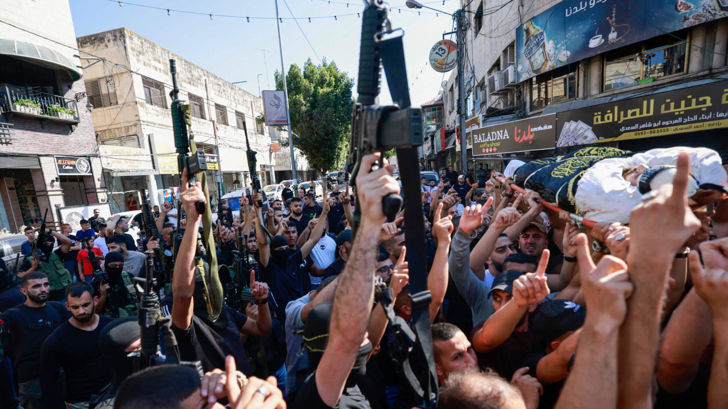 Relatives and gunmen attend the funeral of five Palestinians killed in an Israeli attack in Jenin in the occupied West Bank, August 6.