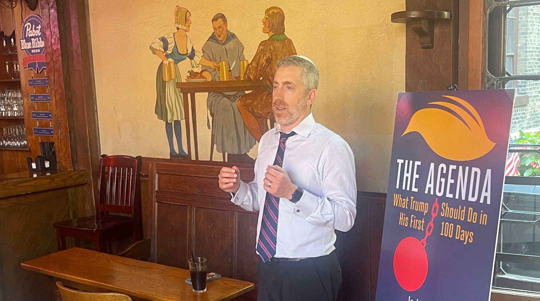 Joel Pollak launches his book, “The Agenda,” at a theme tavern at the Republican National Convention in Milwaukee, July 18, 2024. (Ron Kampeas)