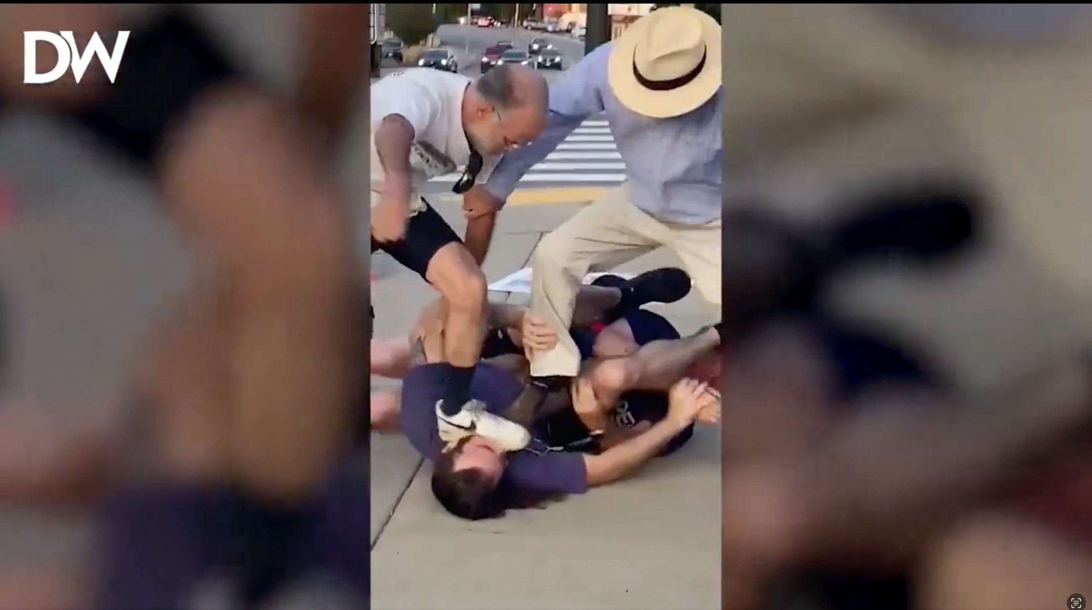 Pro-Israel protesters subdue a man who charged one of them and who was shot during the altercation, Newton, Massachusetts, Sept. 12, 2024. (Daily Wire on X)