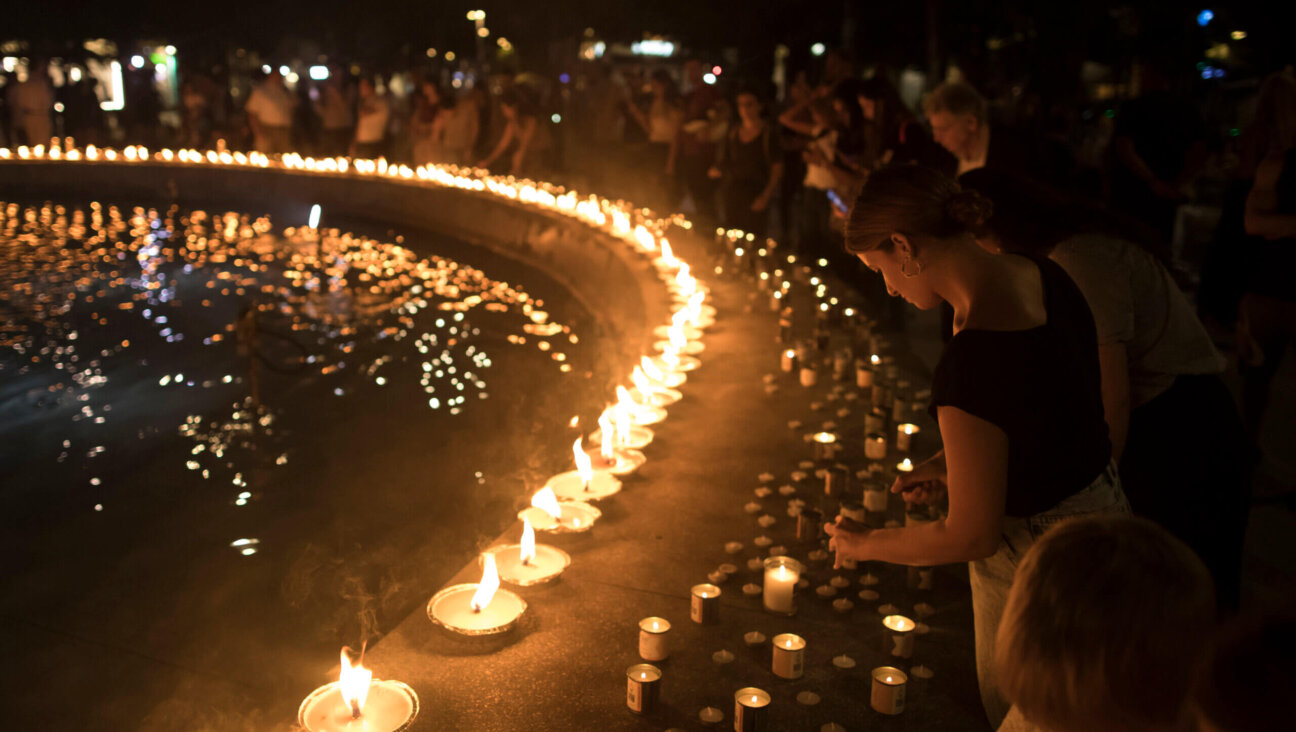 People light candles in memory of the civilians and soldiers killed during the Oct. 7, 2023, Hamas attack on Israel.