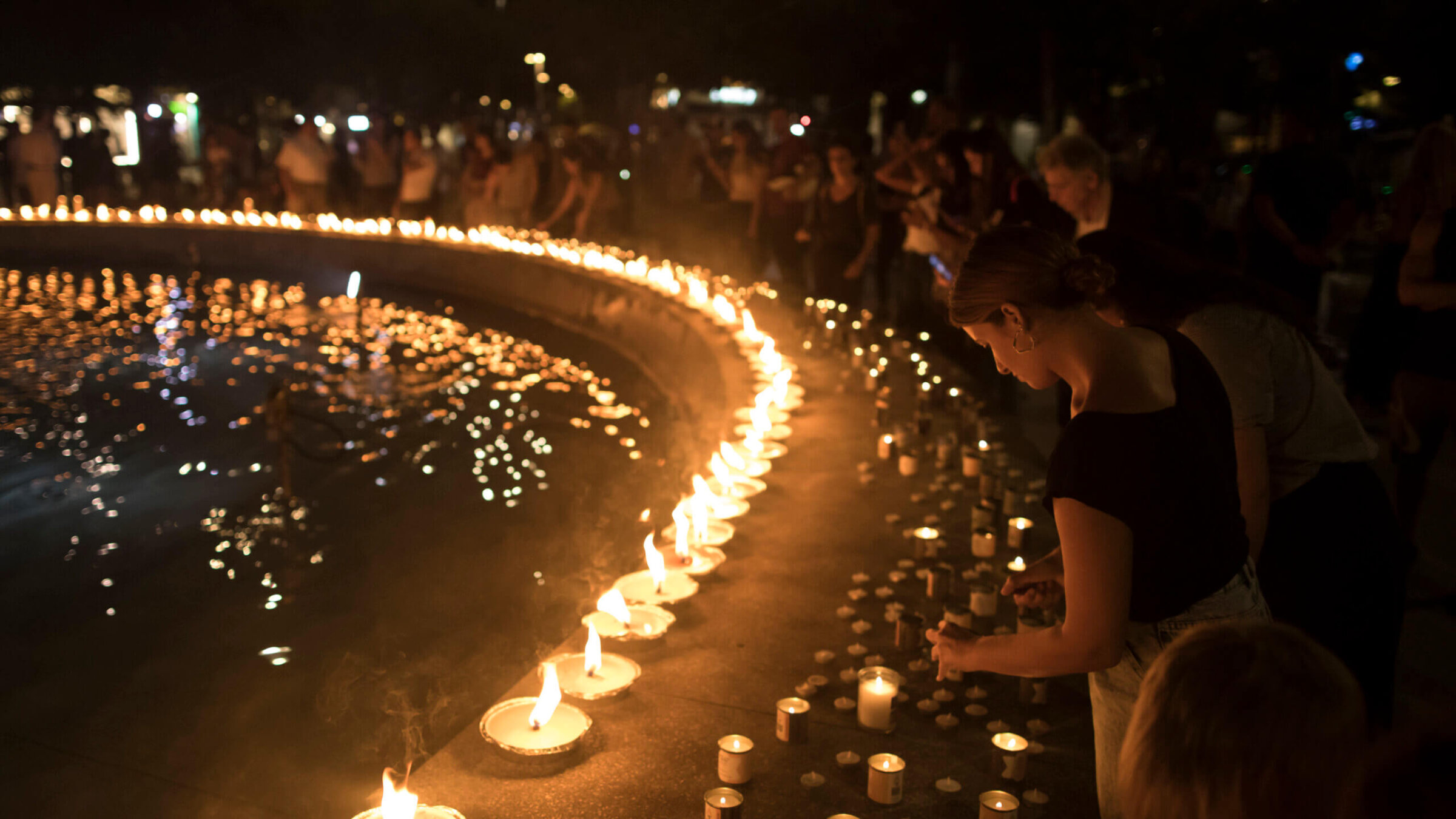 People light candles in memory of the civilians and soldiers killed during the Oct. 7, 2023, Hamas attack on Israel.