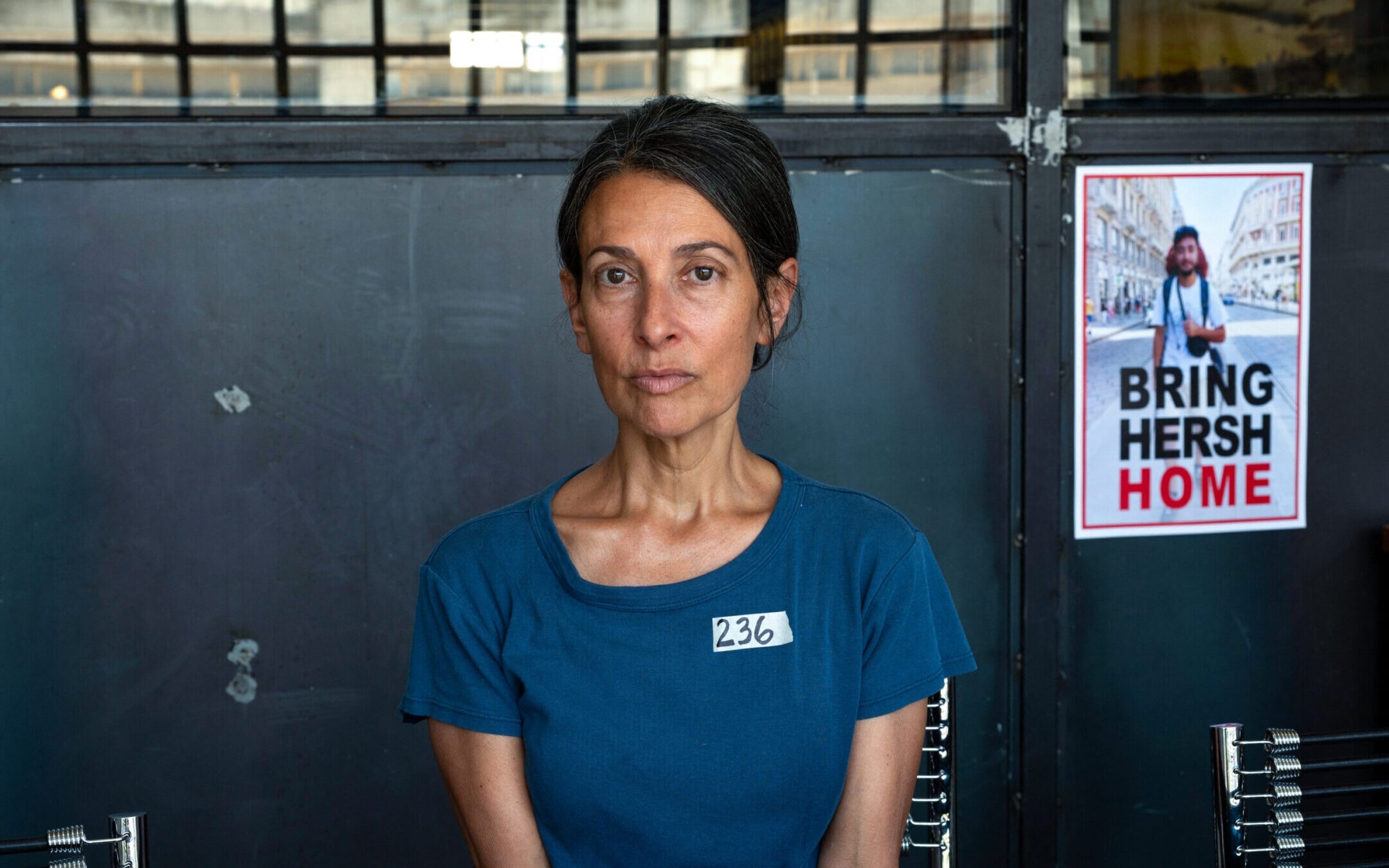 Rachel Goldberg-Polin, the mother of Hersh Goldberg-Polin, who was taken hostage by Hamas on Oct. 7, poses for a photo next to a poster of her son during an interview in Jerusalem, May 29, 2024. (Ahikam Seri/AFP via Getty Images)