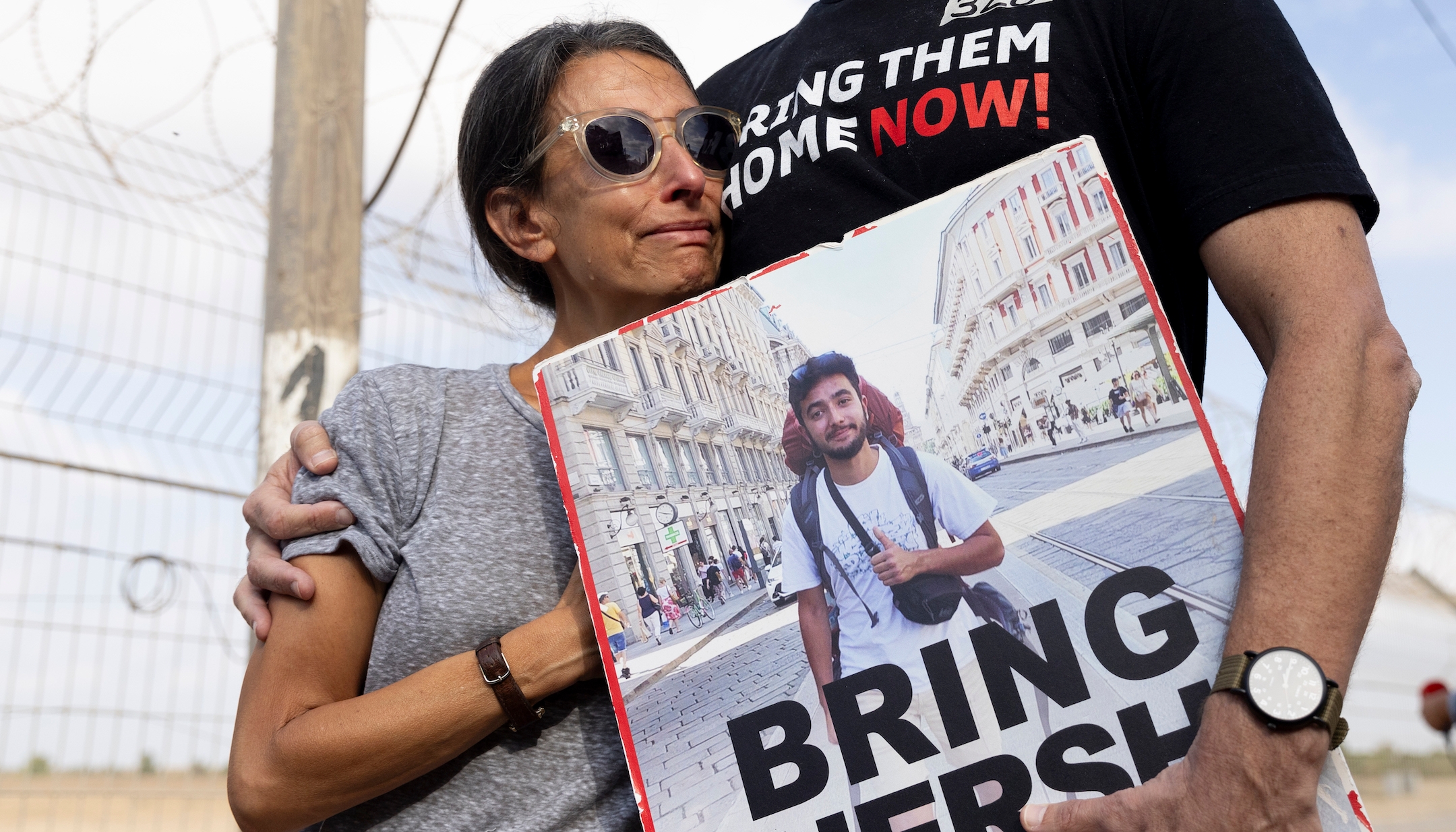 Rachel Goldberg, the mother of hostage Hersh Goldberg-Polin who was kidnapped by Hamas on Oct. 7, stands with her husband as hostage families address Gaza via loudspeaker from Nirim, Israel, Aug. 29, 2024 (Amir Levy/Getty Images)