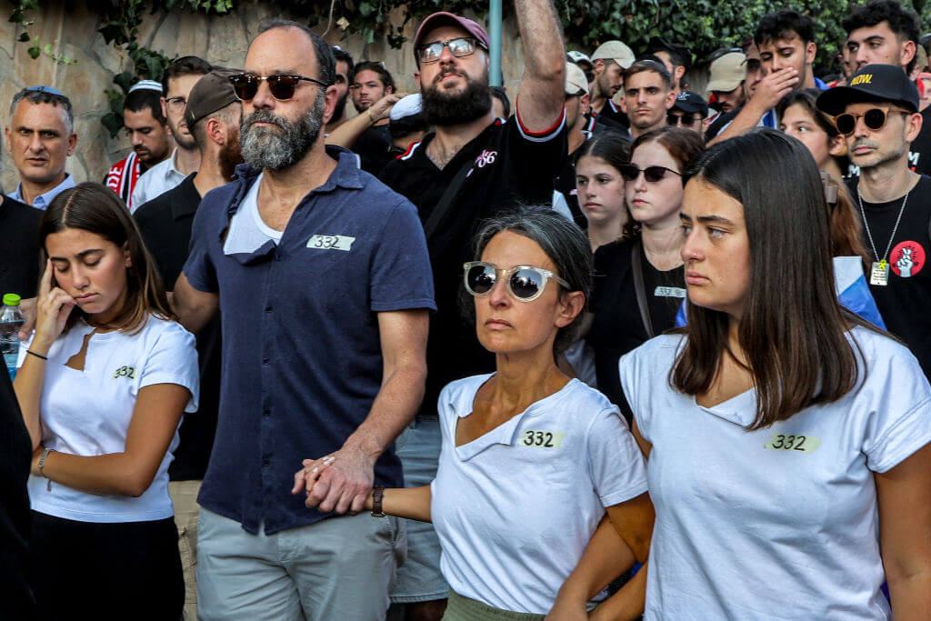 Jonathan Polin and Rachel Goldberg-Polin, parents of killed American-Israeli hostage Hersh Goldberg-Polin, and their two daughters at the funeral in Jerusalem on September 2.