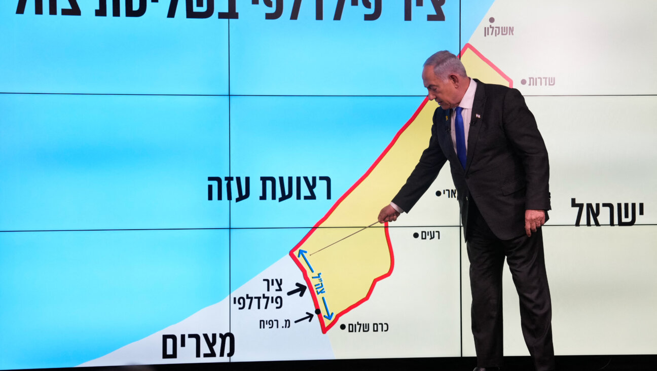 Israeli Prime Minister Benjamin Netanyahu stands before a map of the Gaza Strip, telling viewers that Israel must retain control over the "Philadelphi corridor," a strategic area along the territory's border with Egypt.