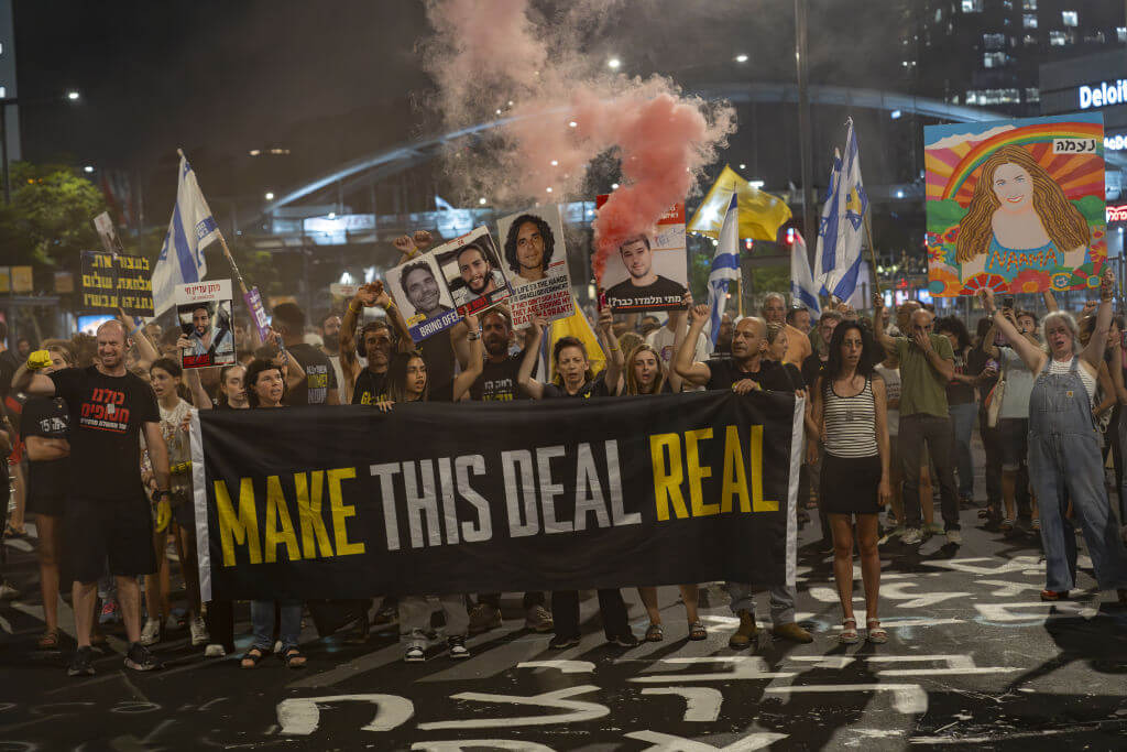 Protesters hold a banner reading "Make This Deal Real" during a demonstration in Tel Aviv, on Wednesday, Sept. 4, 2024.