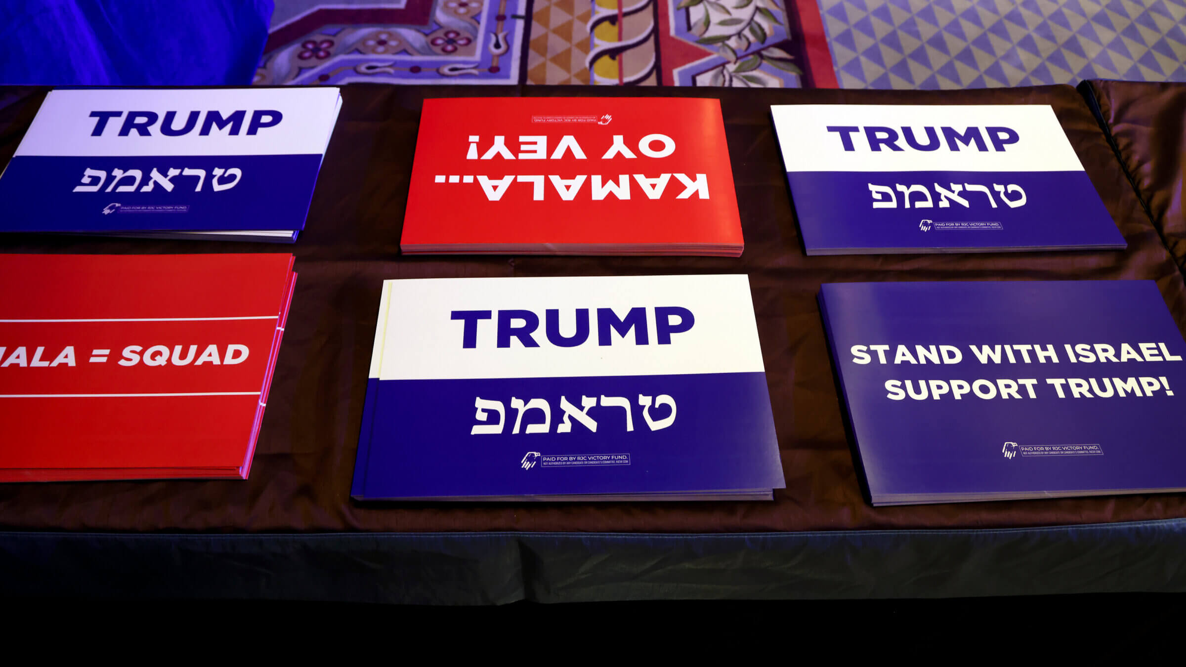 Campaign signs at the Republican Jewish Coalition's  annual conference in Las Vegas Sept. 5.