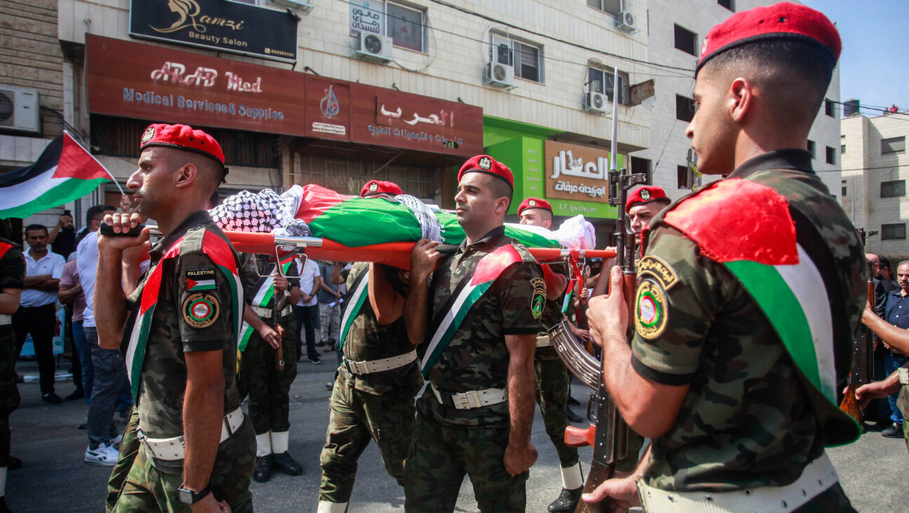 Members of Palestinian security forces carry the body of Turkish-American International Solidarity Movement activist Aysenur Ezgi Eygi during a funeral procession in Nablus in the West Bank. (Nasser Ishtayeh/SOPA Images/LightRocket via Getty Images)