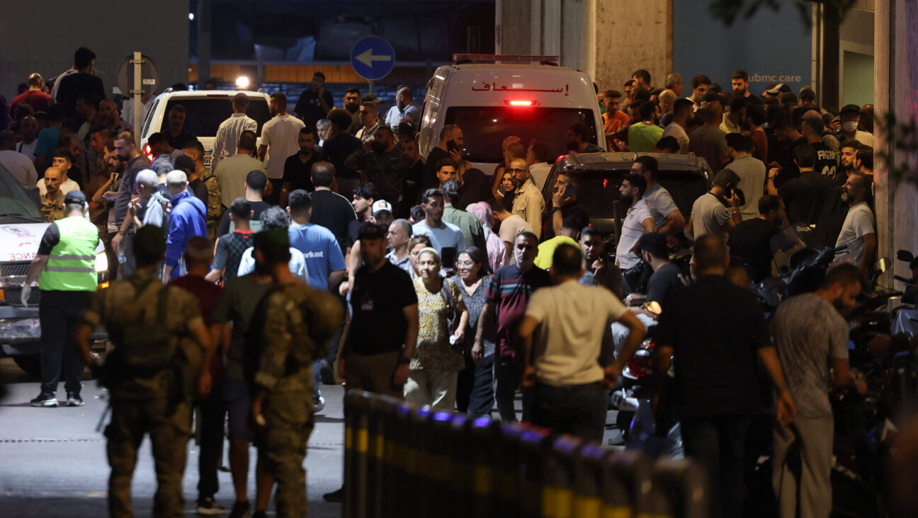 People gathered at the entrance of the American University of Beirut Medical Center on Tuesday, after Hezbollah members' pagers exploded in what appeared to be a coordinated attack that killed at least nine. 