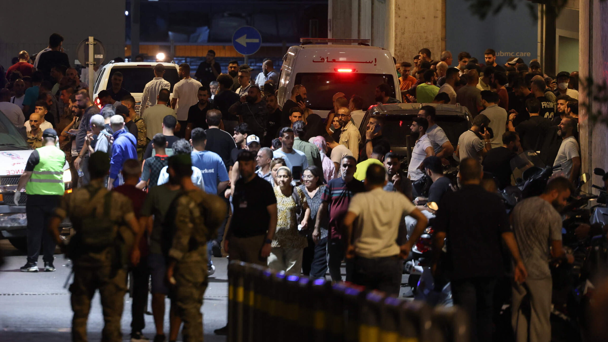 People gathered at the entrance of the American University of Beirut Medical Center on Tuesday, after Hezbollah members' pagers exploded in what appeared to be a coordinated attack that killed at least nine. 