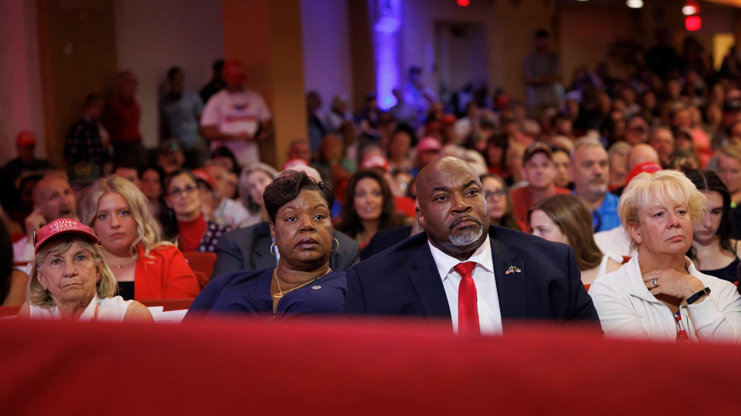 North Carolina Lt. Governor Mark Robinson sits with his wife, Yolanda Hill Robinson, during a campaign event for Republican presidential nominee Donald Trump in the state last month.