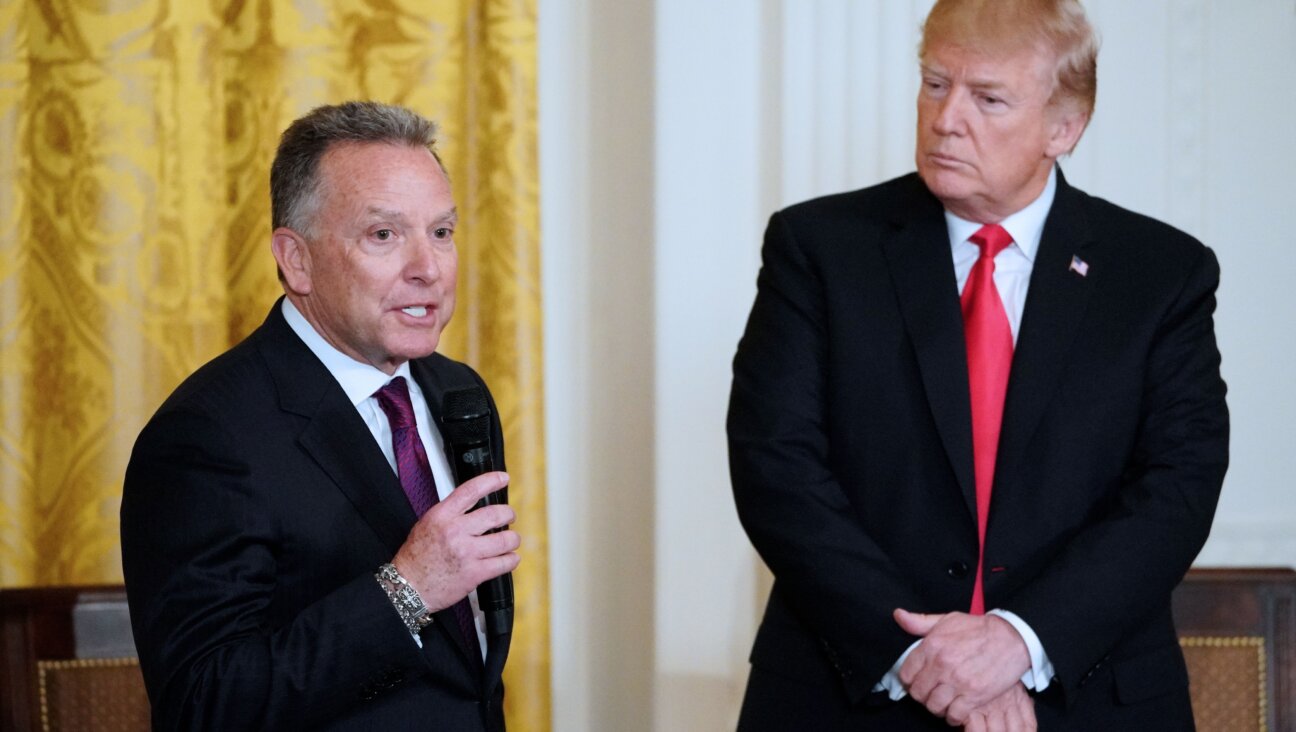 Then President Donald Trump watches his friend Steve Witkoff, who's son died of a prescription drug overdose, speak at the White House Opioid Summit in March 2018. 