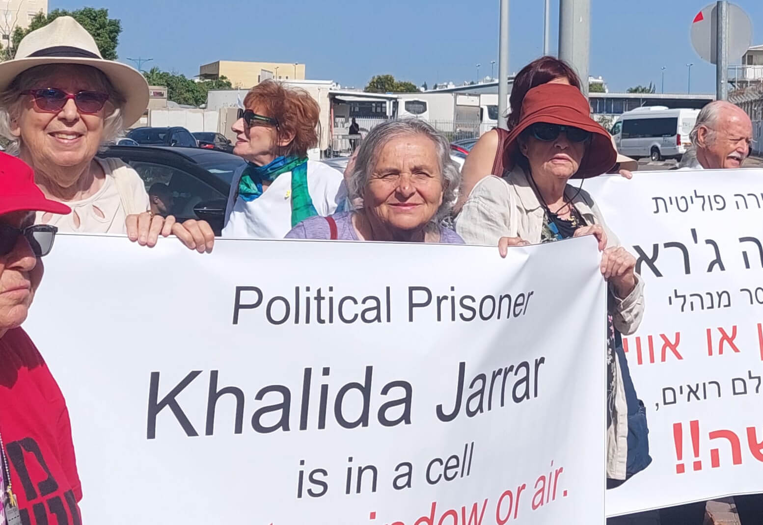 Veronika Cohen protests outside Neve Tirza prison, where Israel has indefinitely detained Palestinian legislator Khalida Jarrar.