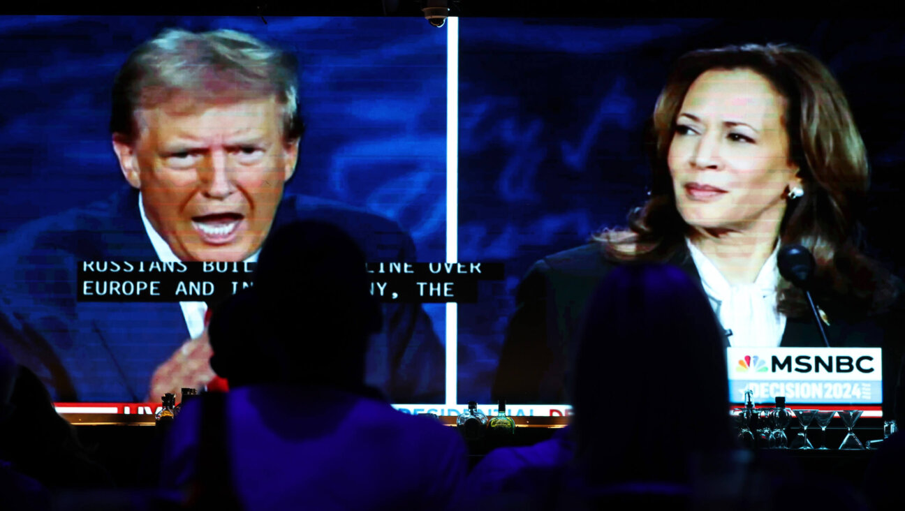 People watch the debate in September between Democratic presidential nominee, Vice President Kamala Harris, and Republican presidential nominee, former President Donald Trump. 