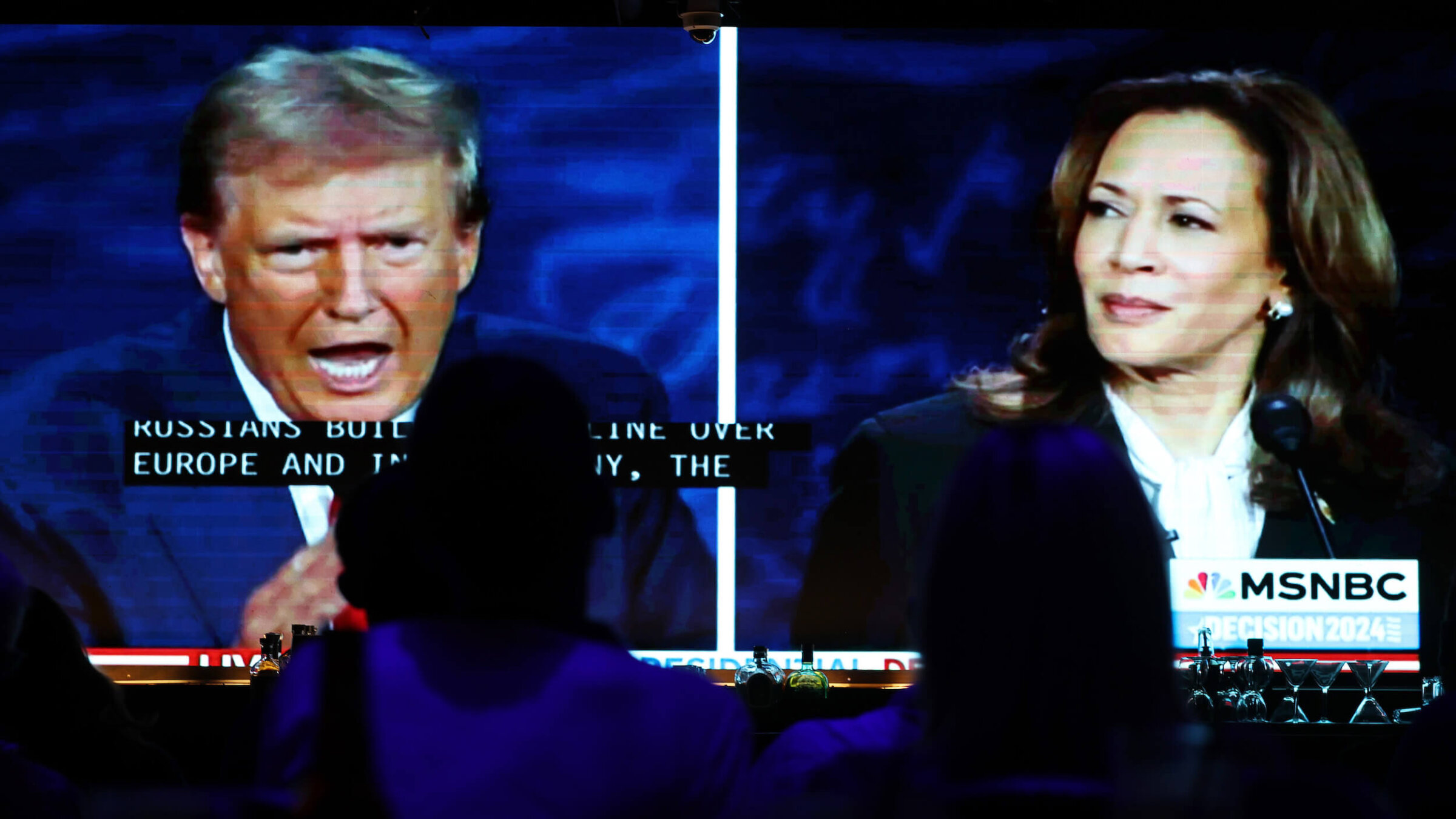 People watch the ABC News presidential debate between Democratic presidential nominee, Vice President Kamala Harris, and Republican presidential nominee, former President Donald Trump. 