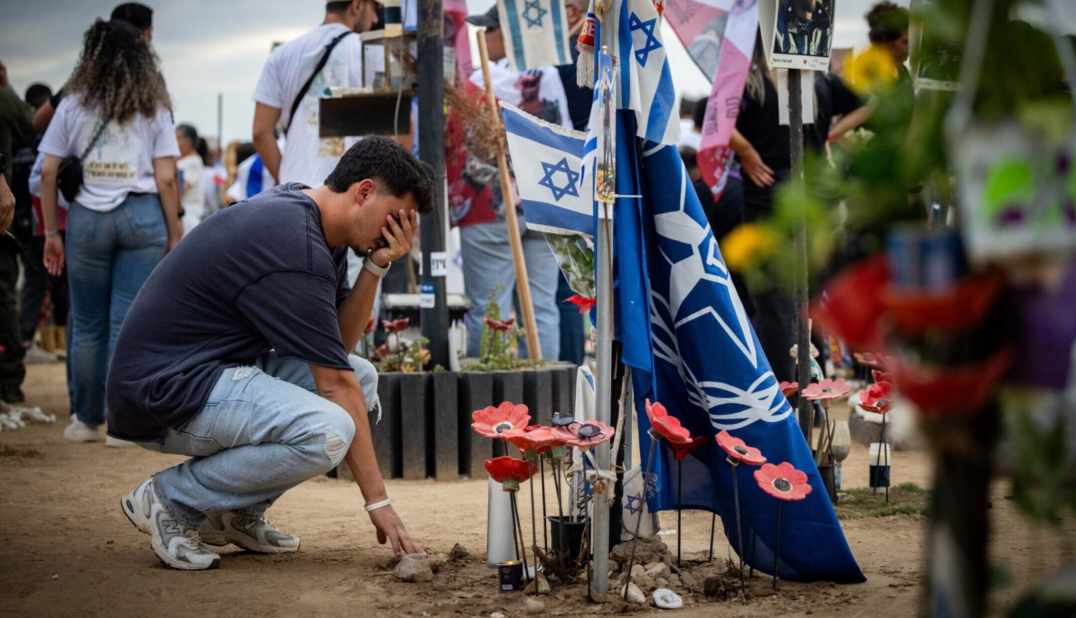 Friends and family of the victims of the Nova music festival massacre gather at the site of the massacre in southern Israel one year after the attack, Oct. 7, 2024. (Yonatan Sindel/Flash90)