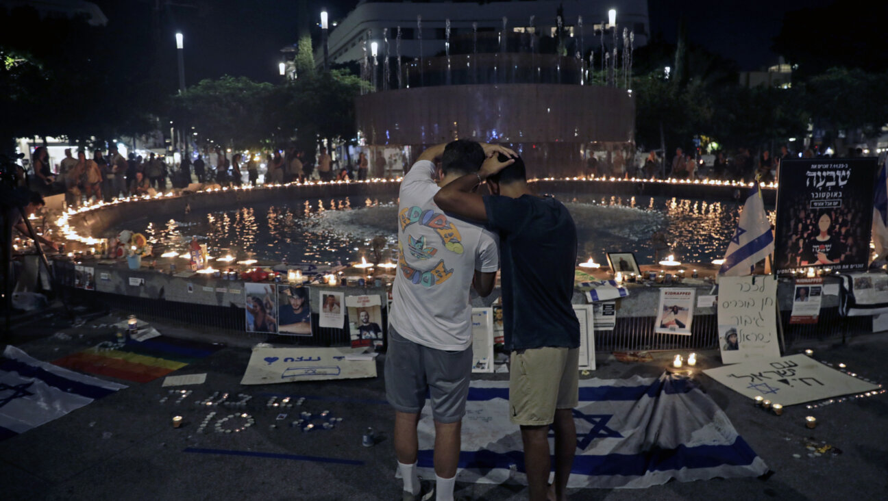 People attend a candle-light vigil as a tribute to the people killed and kidnapped in the October 7th attacks around the fountain in Dizengoff Square on November 07, 2023 in Tel Aviv, Israel. 