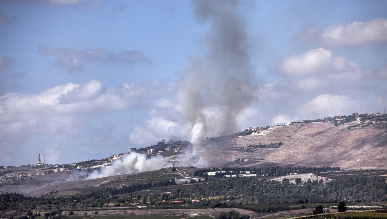 A smoke plume billows from a fire that broke out after a rocket fell in the Israeli side of the border with Lebanon, in the Upper Galilee region of northern Israel, on Oct. 2, 2024. 