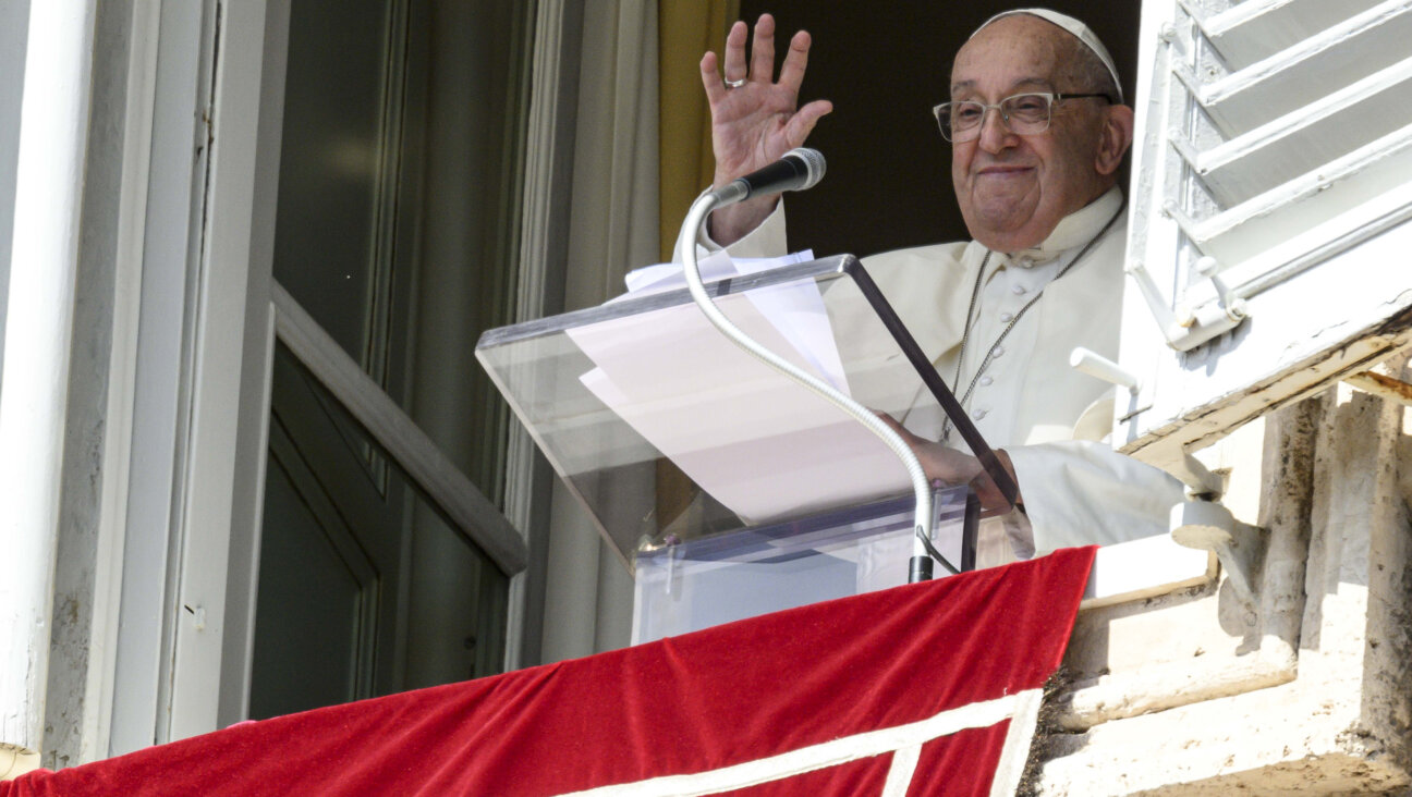 Pope Francis waves to the thousands of faithful gathered in St. Peter's Square, where he announced a fast for Oct. 7.