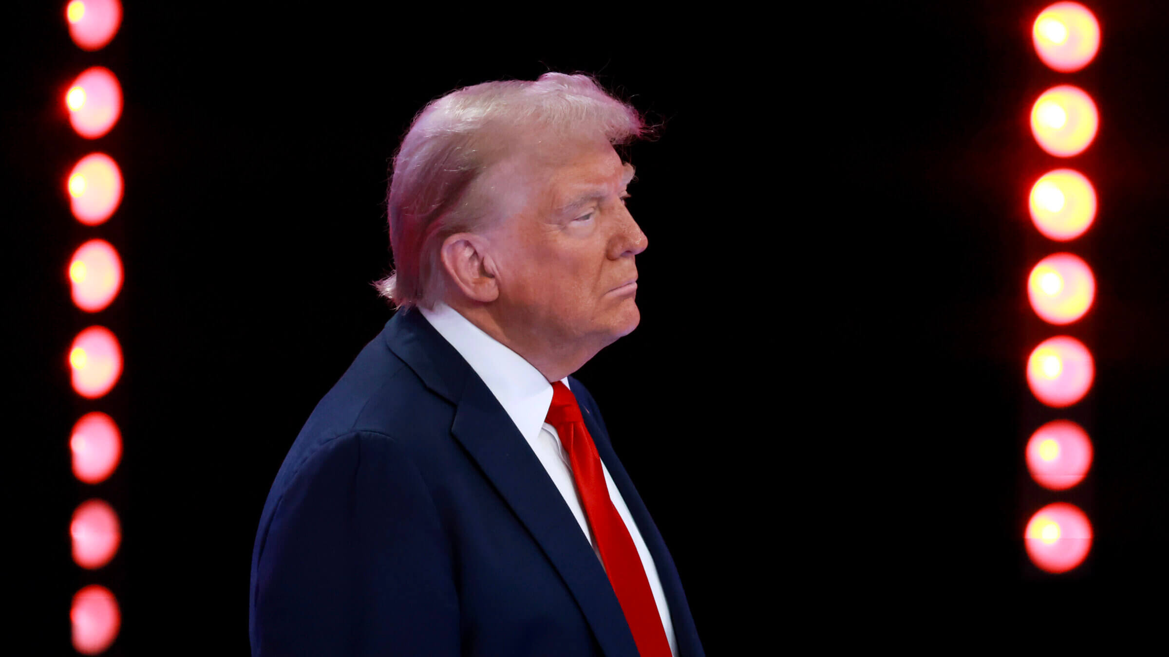     Republican presidential candidate and former U.S. President Donald Trump looks on during a Univision Noticias town hall event on October 16, 2024 in Doral, Florida.