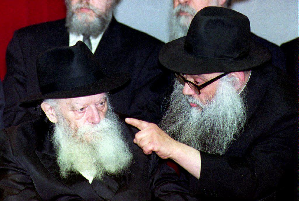 Menachem Mendel Schneerson listening to one of his advisors in 1993.