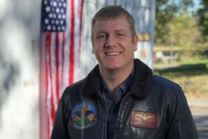 Ken Harbaugh with American flag in background