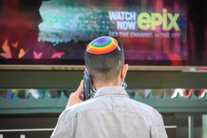 A person wears a pride themed yarmulke in the West Village on the 50th anniversary since the first march following the Stonewall Inn riots. 