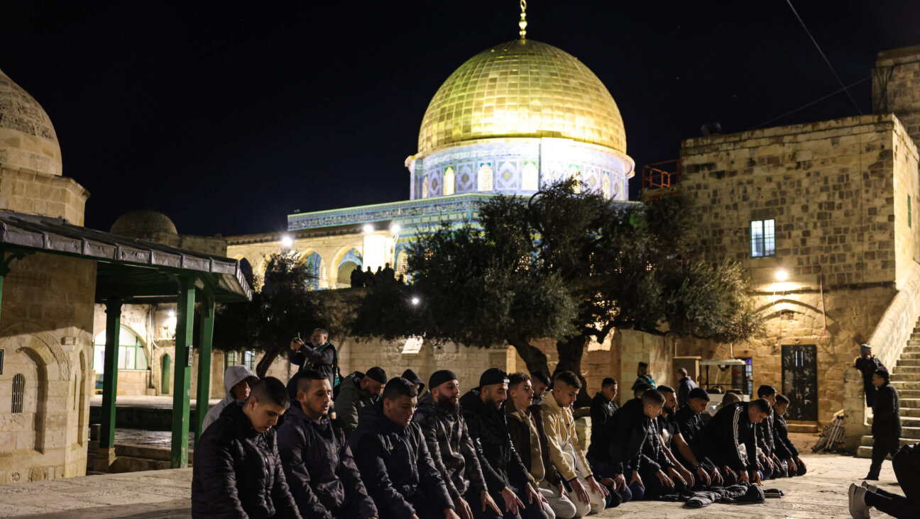 Palestinian Muslims perform an evening prayer known as 'Tarawih' outside Jerusalem's al-Aqsa Mosque compound on March 11. 