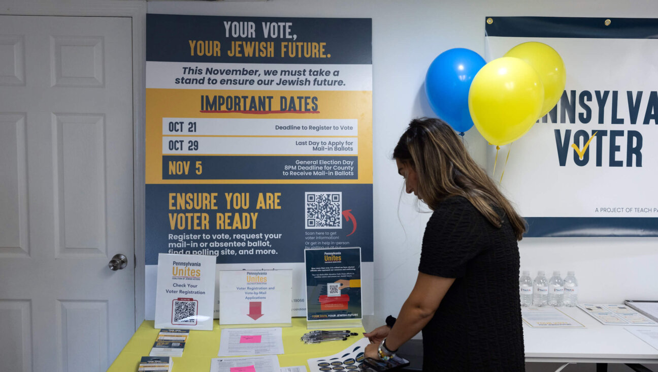 A woman takes a sticker at a Jewish Get Out The Vote center opened by Pennsylvania Unites in Merion Station, Pennsylvania, on Sept. 17.