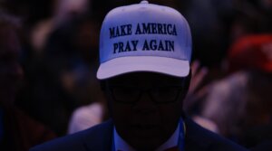 Attendees wear hats reading “Make America Pray Again” before former U.S. President and 2024 presidential hopeful Donald Trump addresses Christian broadcasters at the National Religious Broadcasters International Christian Media Convention in Nashville, Tennessee, on Feb. 22, 2024. (Kevin Wurm/AFP via Getty Images)