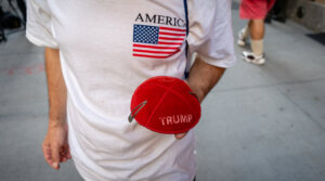 Ariel Kohane, a supporter of Donald Trump, holds a Trump kippah in front of Trump Tower in midtown Manhattan, Nov. 6, 2024. (Luke Tress)