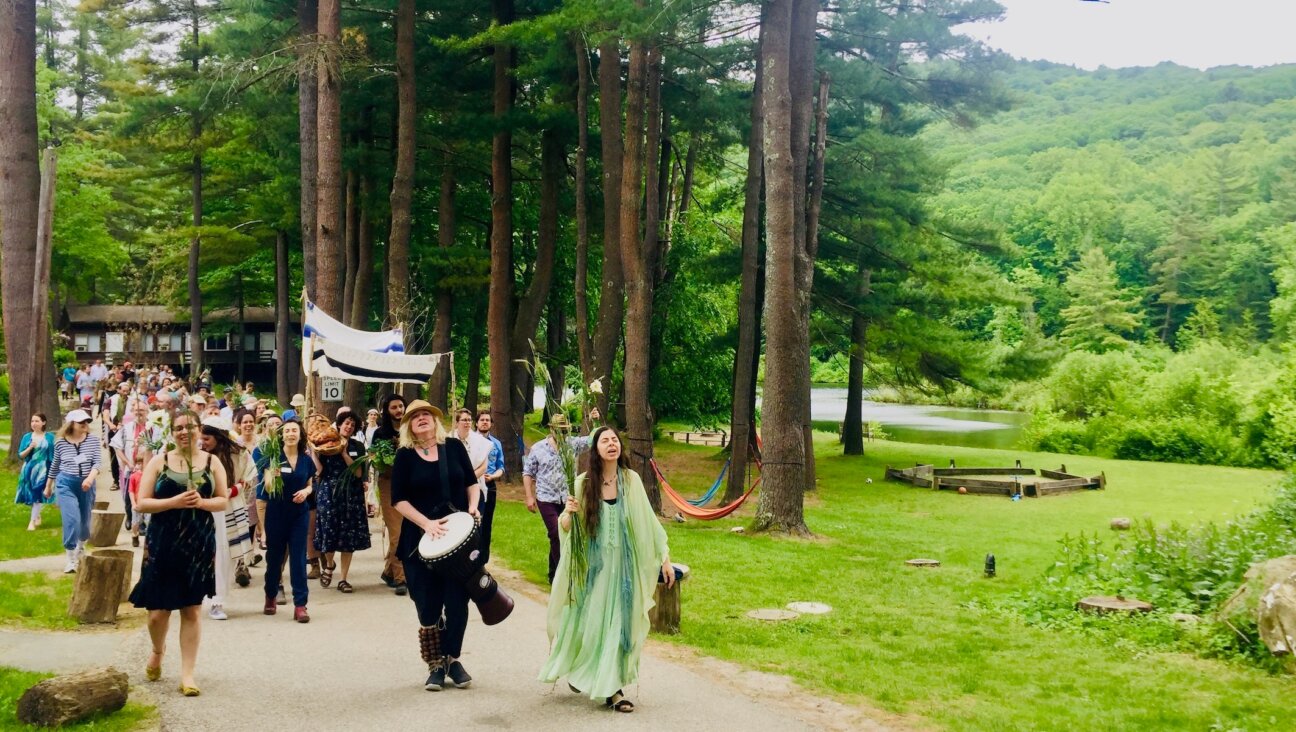 A Shavuot parade at the Isabella Freedman Jewish Retreat Center, a Hazon-operated complex in Falls Village, Conn. Hazon is merging with the Pearlstone Center outside Baltimore to create a combined Jewish environmental group budgeted at $12 million. (Courtesy of Pearlstone)