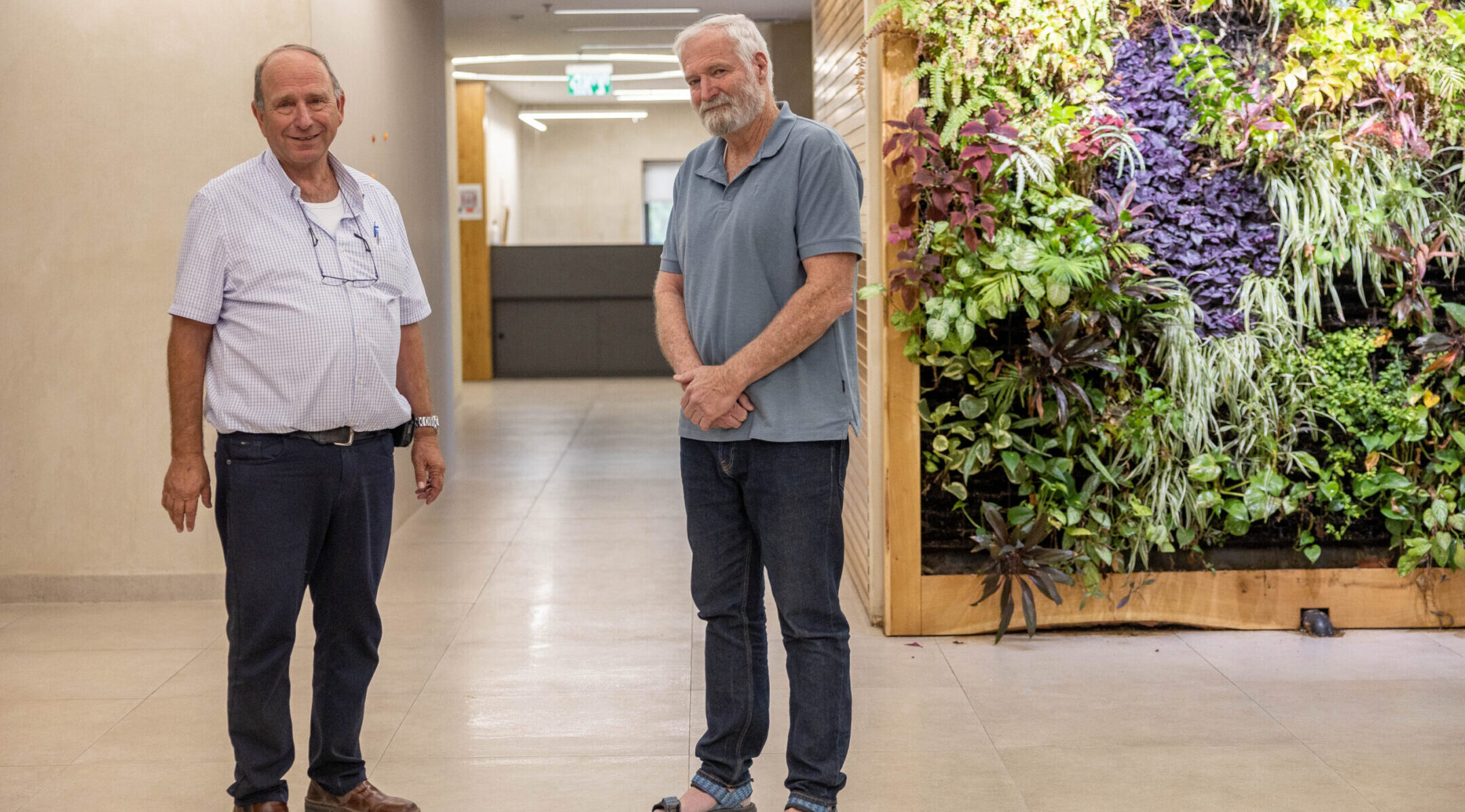 Ze’ev “Zambish” Hever and CEO of Amana Dobi Diner pose for a picture at the Amana offices in Jerusalem, June 13, 2023. (Yonatan Sindel/Flash90)