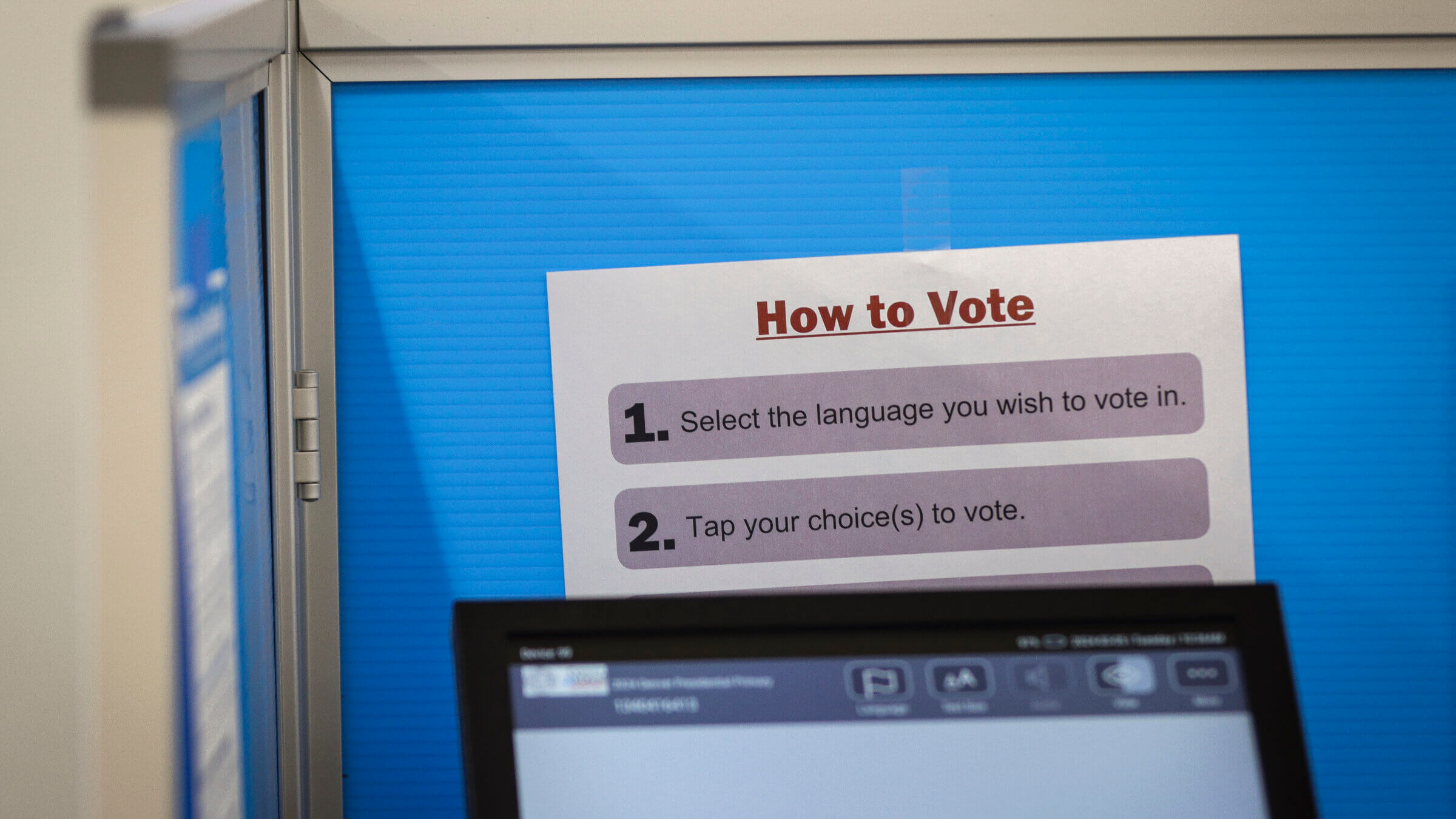 Directions on how to vote in a voting booth.