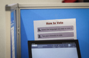 Directions on how to vote in a voting booth.