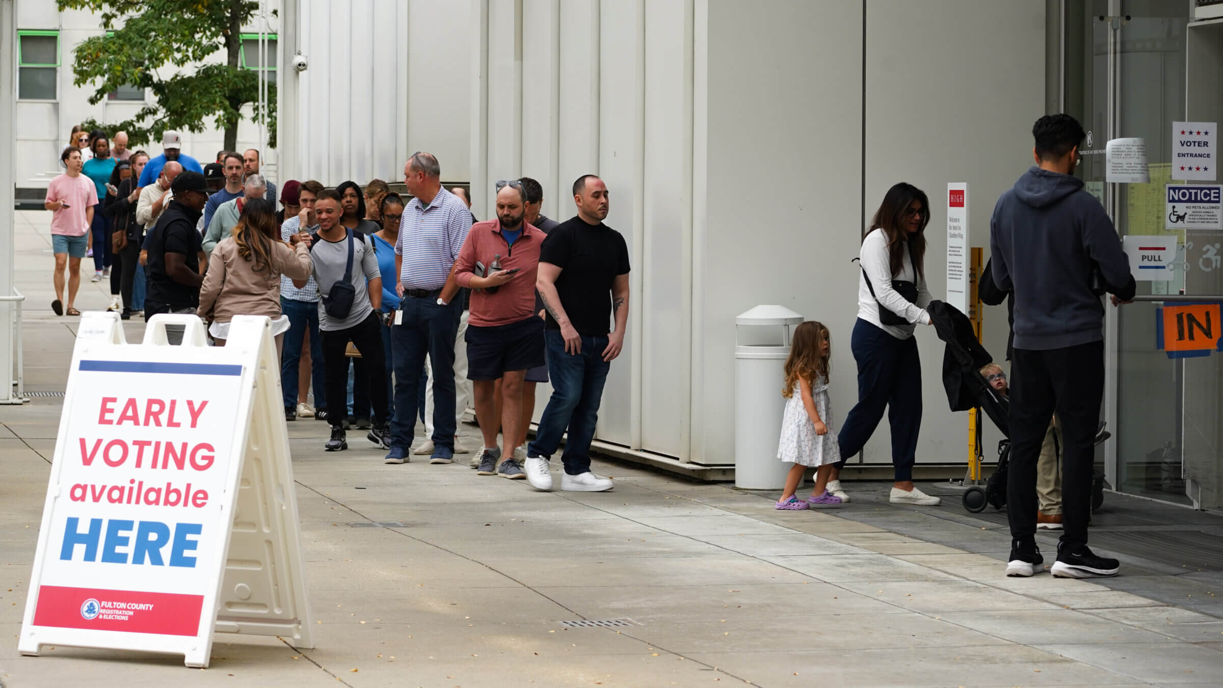 Voters head into a polling location to cast their ballots on the last day of early voting for the 2024 election on Nov. 1 in Atlanta.