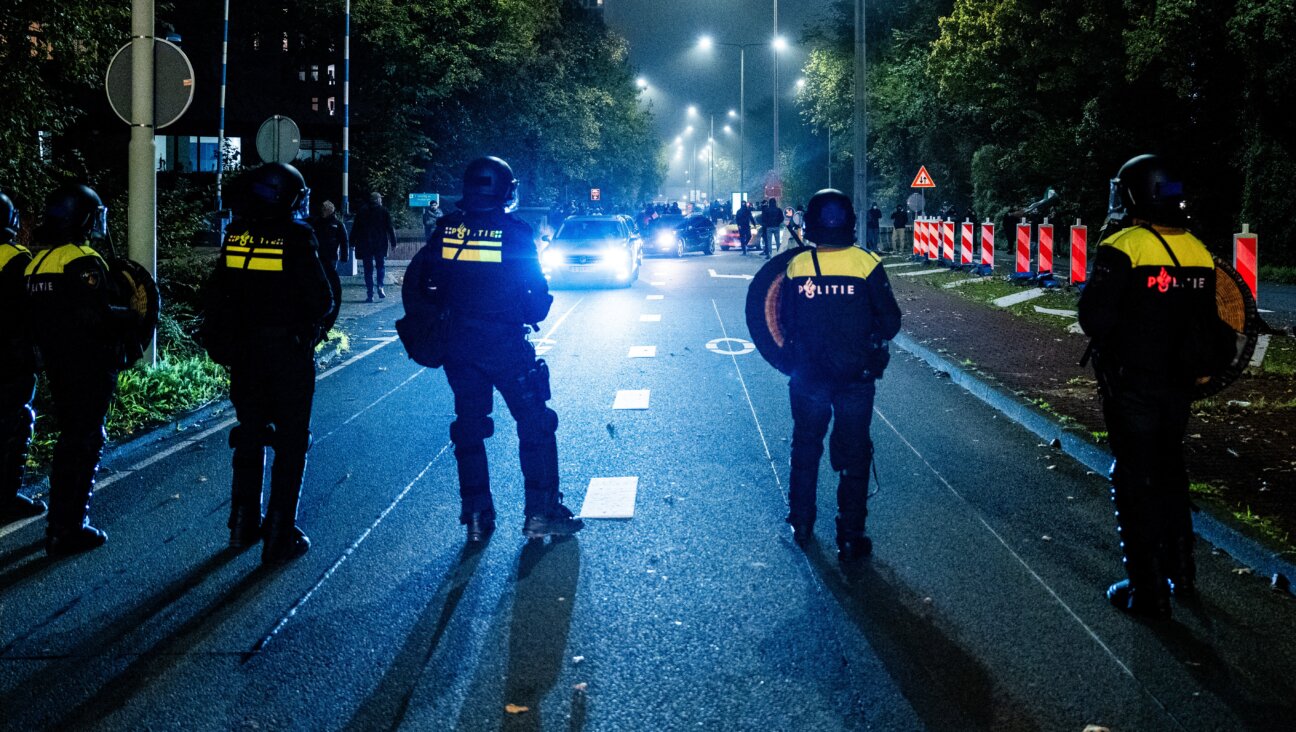 Police officers secure during a pro-Palestinian demonstration on the sideline of the soccer game between Ajax Amsterdam and Maccabi Tel Aviv, in Amsterdam on Thursday.