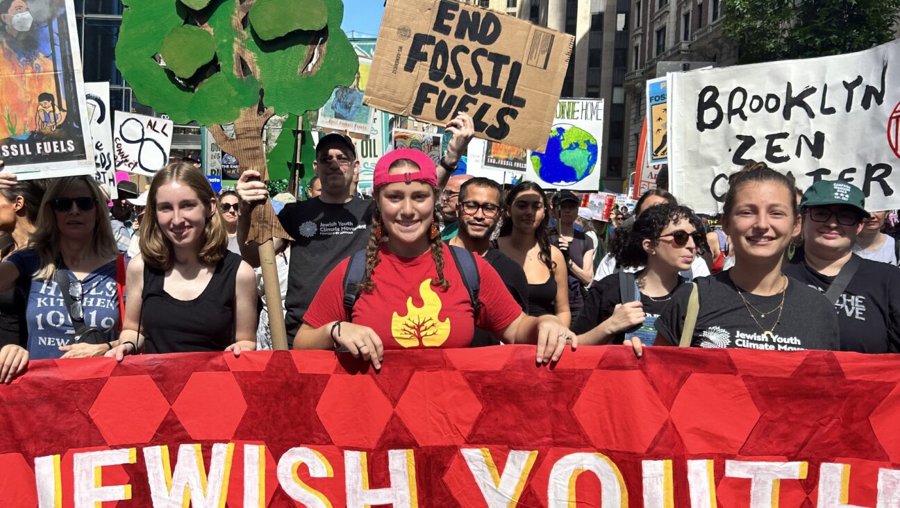 Demonstrators from the Jewish Youth Climate Movement march in front of the offices of BlackRock calling for divestment from fossil fuel companies. 