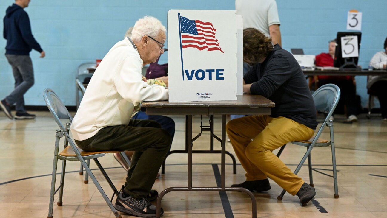 Voters fill out their ballots at a polling station in Grand Rapids, Michigan, Oct. 29, 2024. (Joshua Lott/The Washington Post via Getty Images)